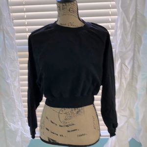 Black cropped sweatshirt.